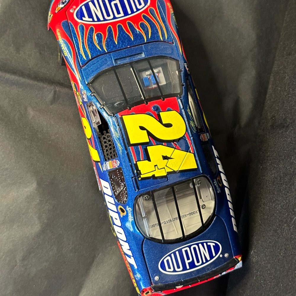 Race car #24 driven by Jeff Gordon.  9” long, 3” wide, 2” high.  Die cast.